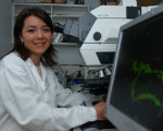 Researcher looking at samples under microscope at the Brain Repair Centre 